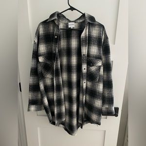 Black and white flannel shacket from Isabelle’s Cabinet!!